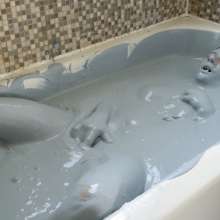 Stella: Stella takes a bath in a tub full of grey-t slime.