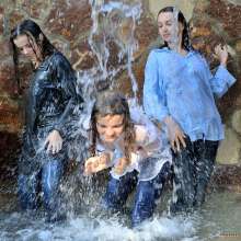 ufa217: Three girls have water fun in recreation center.