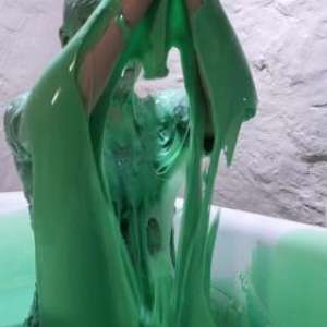 Stella: Stella bathes in a tub filled with 30 gallons of green gunge.