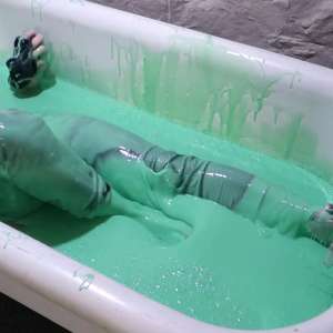 Stella: Stella bathes in a tub filled with 30 gallons of green gunge.